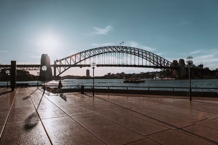 Out the front of the Sydney Opera House looking out to the Harbour Bridge, desolate due to COVID-19.